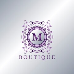 Modern Luxury Boutique Letter M logo. Unique elegance design floral ornament with purple metal circle frame vector design.