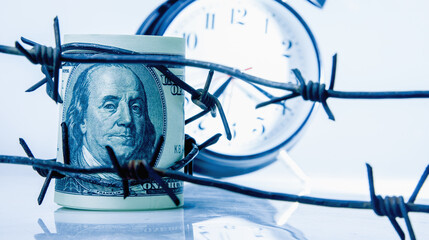 Barbed wire and US Dollar bill as symbol of economic warfare, sanctions and embargo busting....