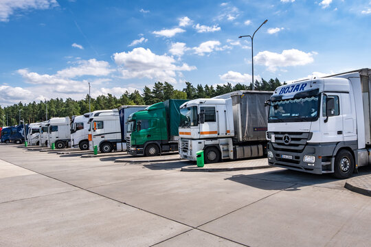 MINSK, BELARUS -  JULY 2020: Trucks in a row with containers in the parking lot, Logistic and Transport concept
