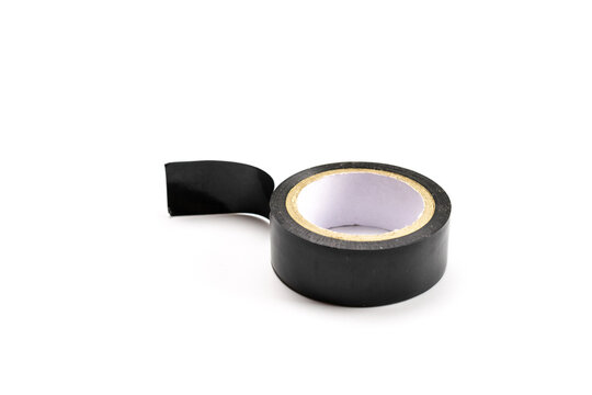 Scotch. Adhesive tape or black sticky paper roll isolated on white. Torn background with strip grunge duct texture.