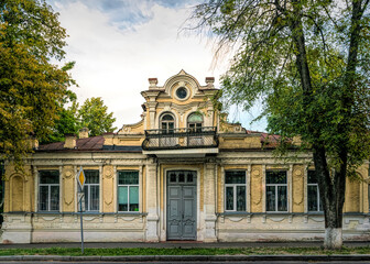 Old dilapidated balcony of an ancient mansion