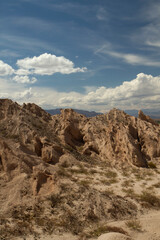 Vertical photo. Arid landscape. Geology. View of the dry valley, sandstone and rocky hills.