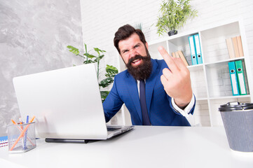 Man aggressive director work online laptop modern office, hatred and disdain concept