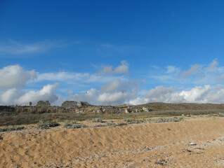 The remains of a stone fortress against a sky.