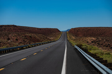 Fototapeta na wymiar Road in mountains, Travel concept and American roadtrip. Empty asphalt highway.