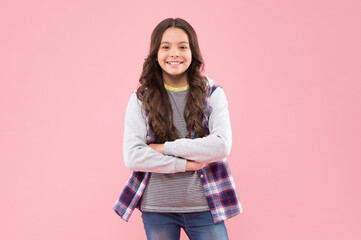 She is really cute. Happy child smile pink background. Beauty look. Little girl child in casual style. Fashion trend. Trendy style. Child care and childhood. International childrens day