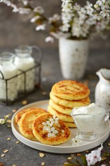 Homemade cheesecakes with sour cream. Homemade breakfast.