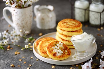 Homemade cheesecakes with sour cream. Homemade breakfast.