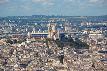 Fototapeta na wymiar View of the Montmartre district of Paris including the Sacre-Coeur Basilica (The Basilica of the Sacred Heart). France