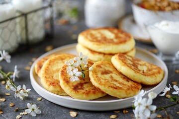 Homemade cheesecakes with sour cream. Homemade breakfast.