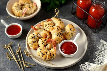 Tiger shrimp tails in Parma ham or jamon and puff pastry. Delicious homemade appetizer.