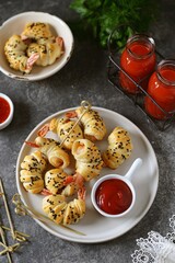 Tiger shrimp tails in Parma ham or jamon and puff pastry. Delicious homemade appetizer.