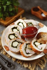 Turkey breast roll with scrambled eggs, spinach and mozzarella. Healthly food.