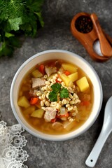 Healthy sprouted mung bean soup with potatoes, carrots, cilantro and turkey breast. Organic food.