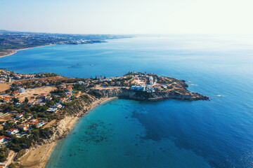 Fototapeta na wymiar Cyprus landscape aerial view of yellow stone coast with villas and blue mediterranean sea.