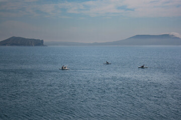 Obraz premium three catamarans in the black sea near the mountains