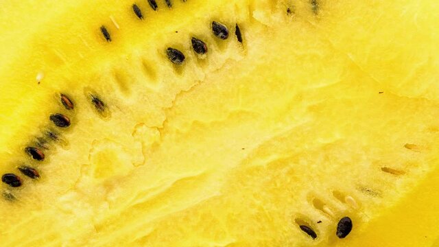Closeup of fresh yellow watermelon slices on plate