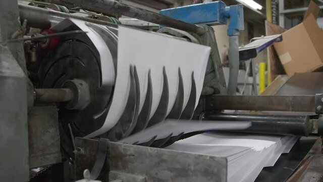 Sorting Machine Handling Large Pieces of Paper At Mail and Paper Printing Press