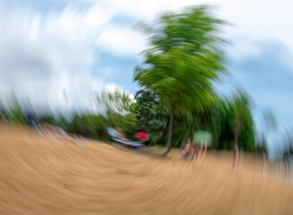 Bright photo with blurred view of group of people.