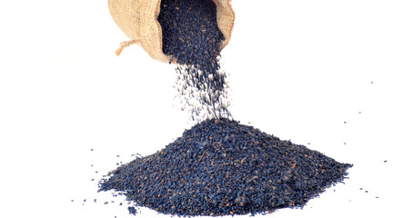 Black sesame seeds on a white background