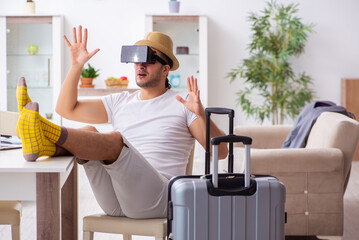 Young man preparing for departure at home