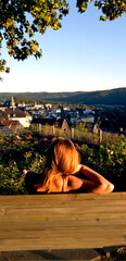 a girl sitting on the bank, relaxing, vacation