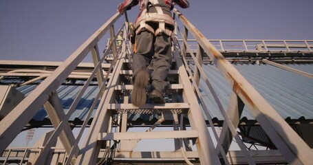 Engineer walking up staircase