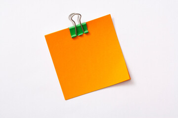 note paper and clip isolated on white background
