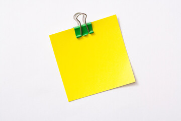 note paper and clip isolated on white background
