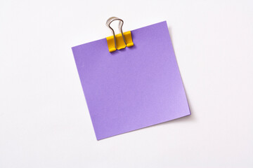 note paper and clip isolated on white background
