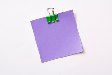 note paper and clip isolated on white background
