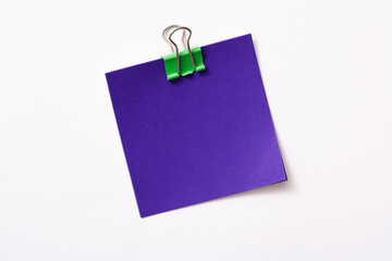 note paper and clip isolated on white background

