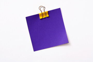 note paper and clip isolated on white background
