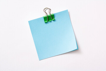 note paper and clip isolated on white background
