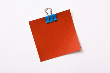 note paper and clip isolated on white background
