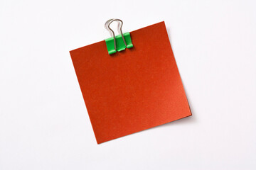 note paper and clip isolated on white background
