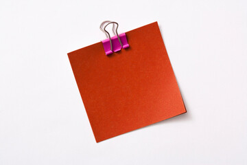 note paper and clip isolated on white background
