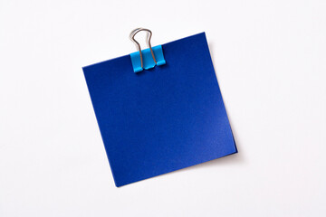 note paper and clip isolated on white background
