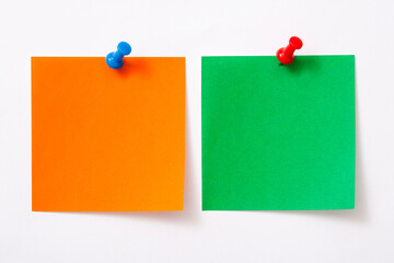 Note paper with pin on white background.
