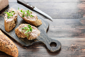 Turkey liver pate on whole grain baguette with microgreens