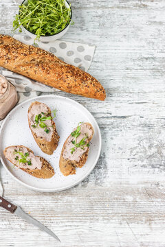 Turkey liver pate on whole grain baguette with microgreens
