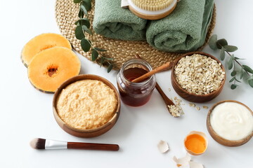 Homemade body care natural cosmetic products top view. Body, face mask with pumpkin, oatmeal, honey, egg and yogurt to moisturize. Self care concept