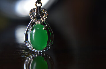 Gemstones jewelery
Is a pendant necklace decorated with green jade