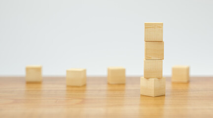 empty wooden cubes for own messages and icons on wooden floor and white background