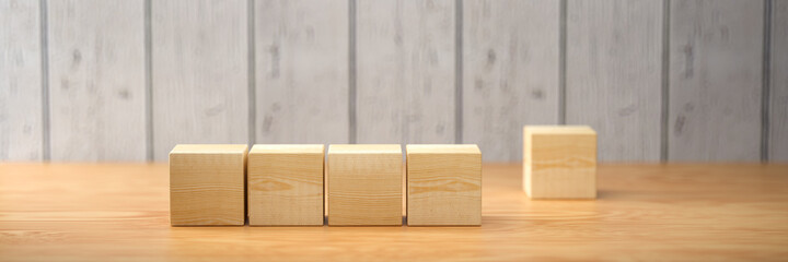 empty wooden cubes for own messages and icons on wooden background