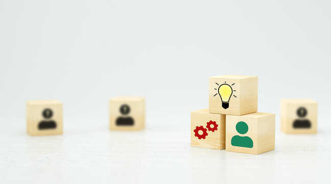 cubes showing a brainstorming session on wooden surface and white background