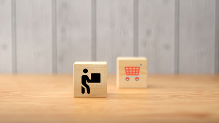 cubes with shopping icons on wooden background