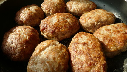 on a frying pan fried cutlets near plan
