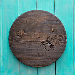 Fototapeta premium round wooden plate on old wooden background