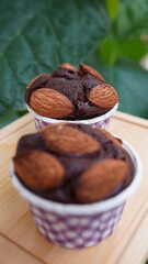 Dark chocolate almonds in a purple cup